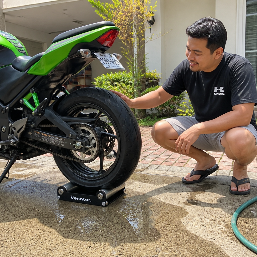 Rider spinning the rear wheel with one hand using the Ventra cleaning bracket