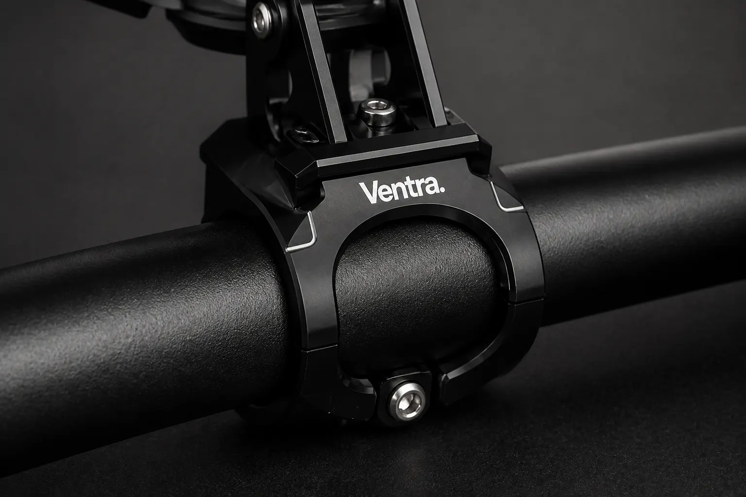 Close-up of the bolt-tightened clamp collar on a handlebar