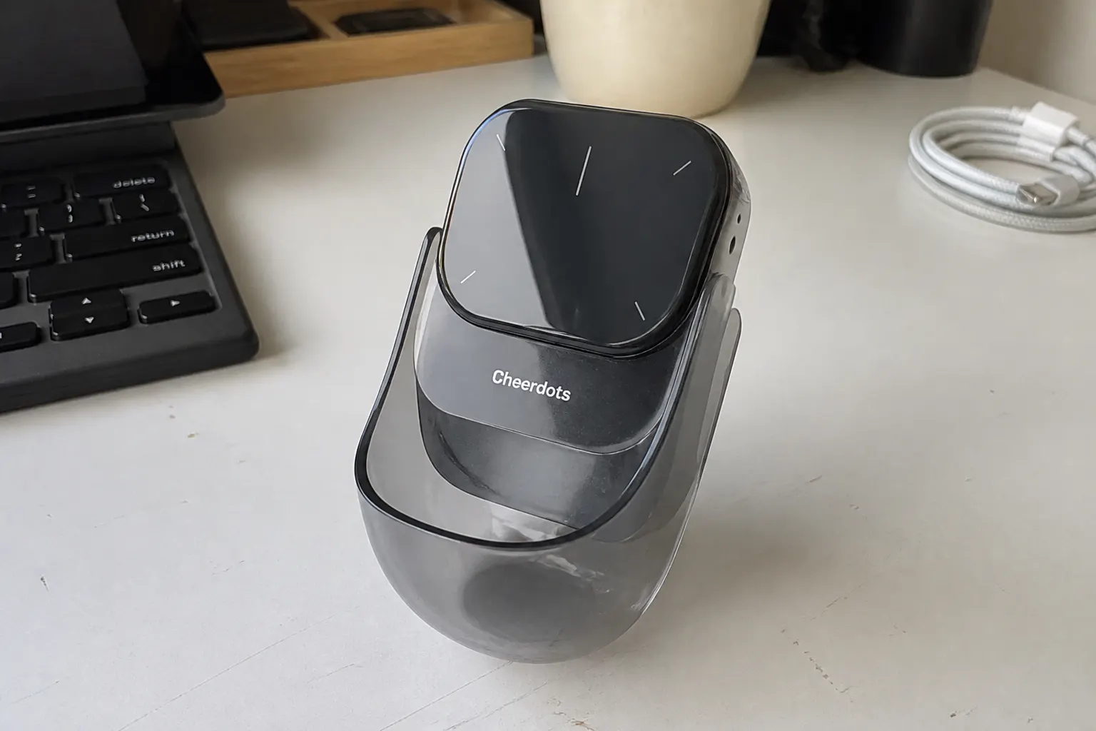 Macro of the glossy MyAvazon module snapping into its curved magnetic base