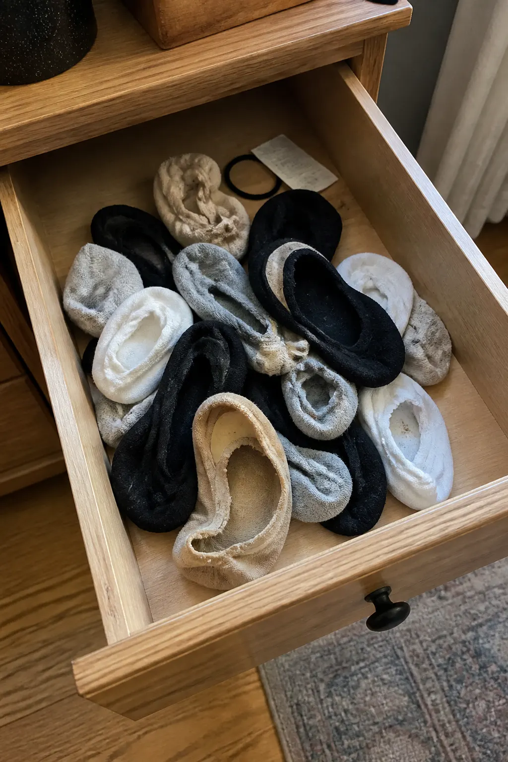 A drawer of failed no-show socks