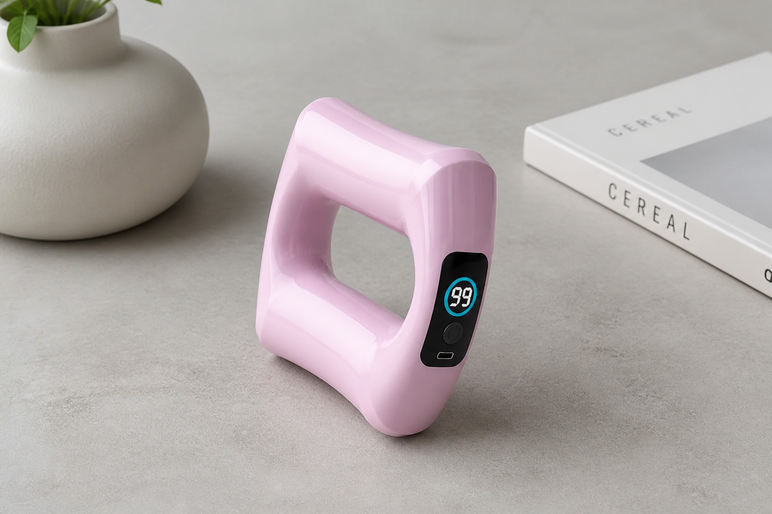 Close-up of the massager showing its digital intensity display and single-button control