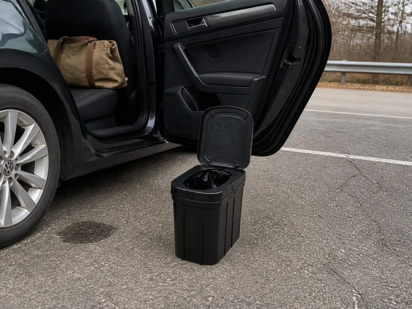 Hands mid-unfold in a car footwell